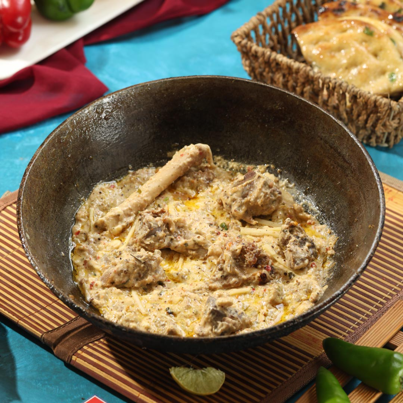 Chicken White Karahi in a traditional black karahi